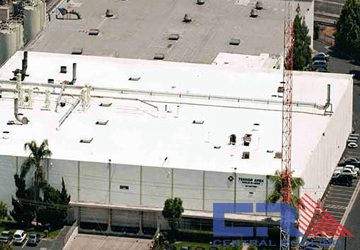 White industrial building with white roof